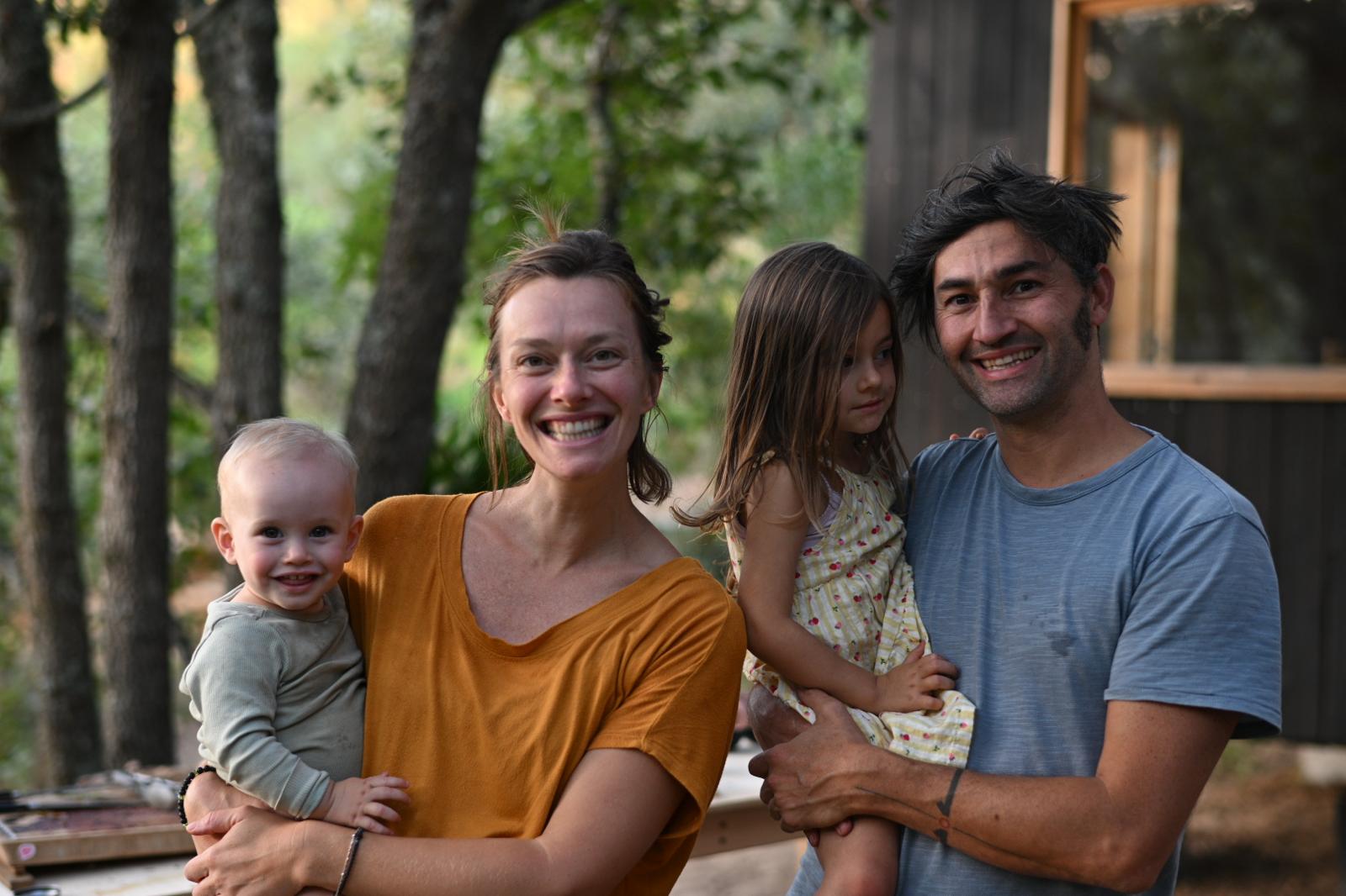 Wendy, Diego and their two children together at the house